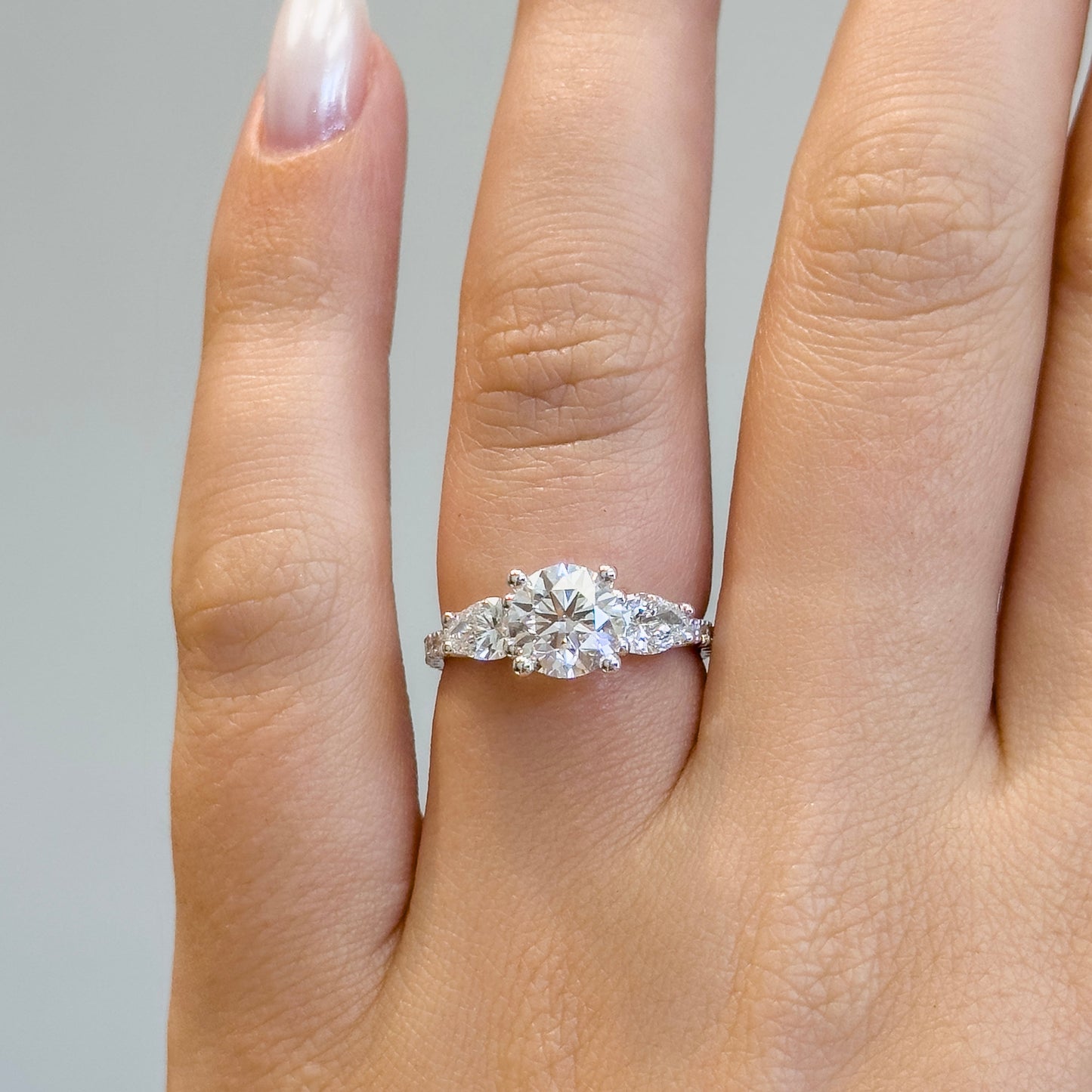 Three Stones Round and Pear Engagement Ring